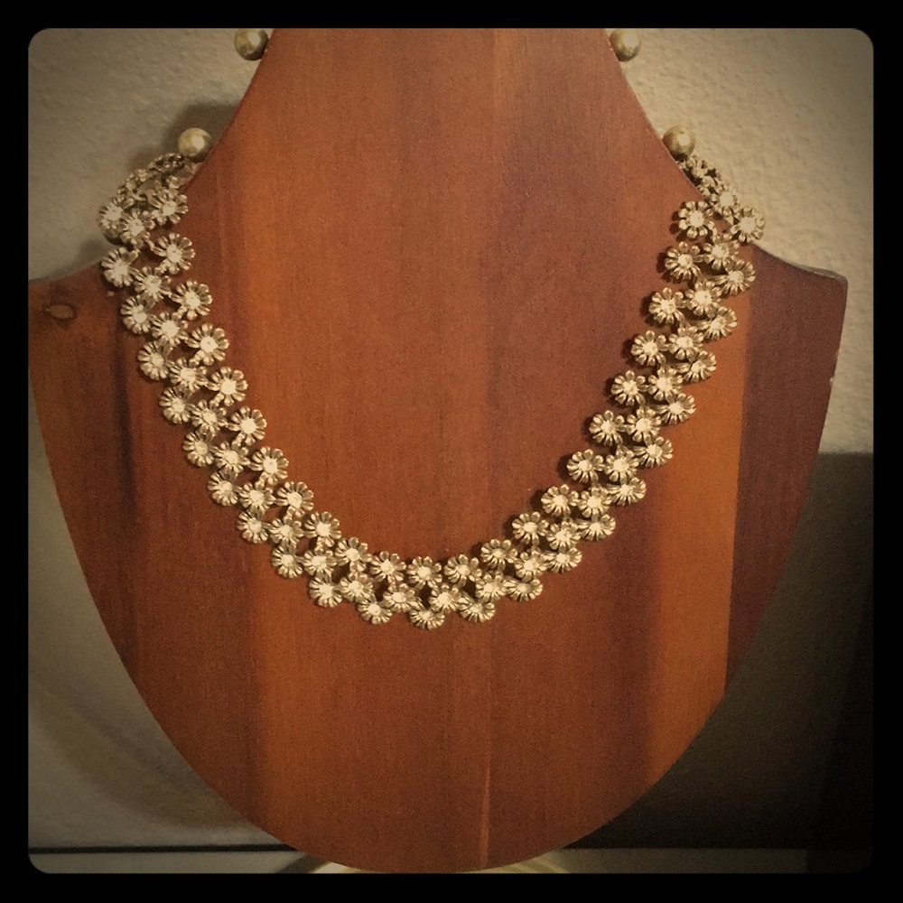 Gold floral necklace.